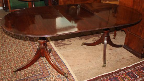 Regency style mahogany twin pedestal extending dining table